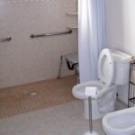Sierra Remodeling designs and builds ADA compliant bathrooms with roll-in shower, grab bars, ADA compliant commode, bidet and sink